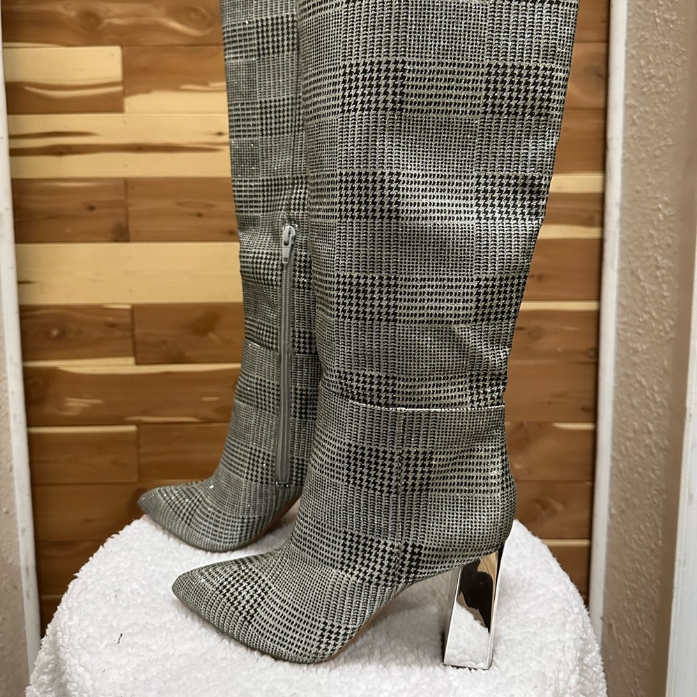 Silver and gray heeled boots.